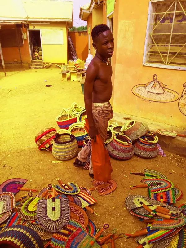 A young craftsman at the Bolgatanga craft market