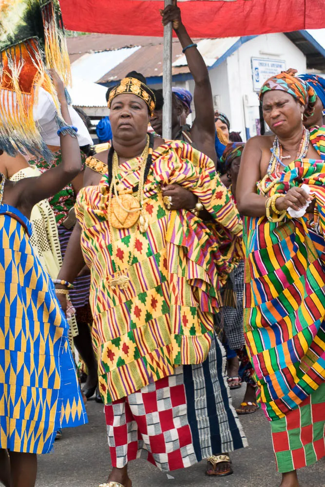 A chief in kente with attendants at Kpetoe