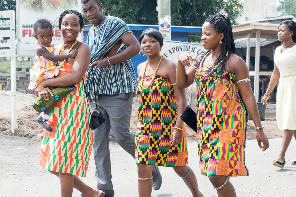 Women in kente walking at the Agbamevoza festival
