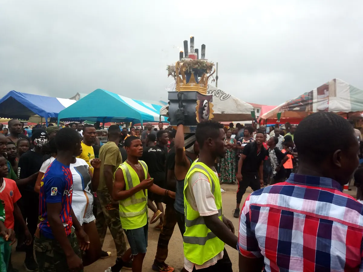 Young people celebrating Homowo in the street