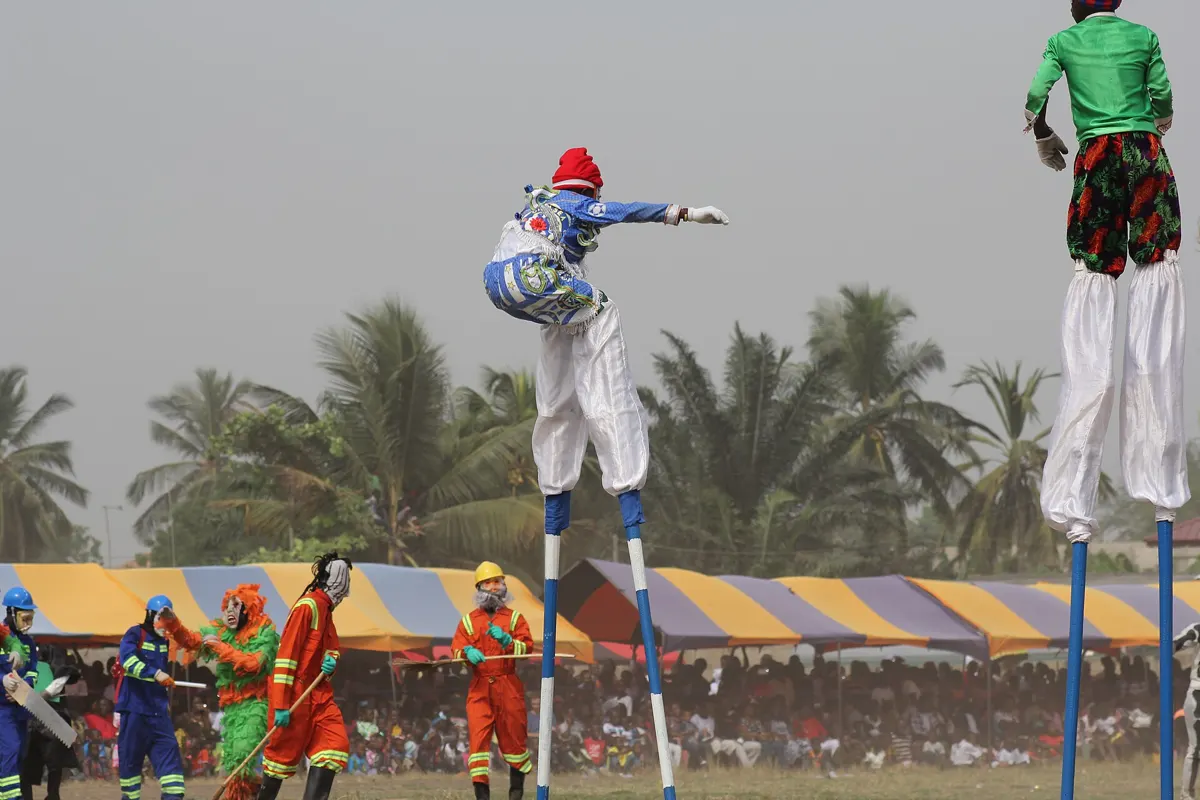 A masquerader on tall stilts at the Winneba Masquerade